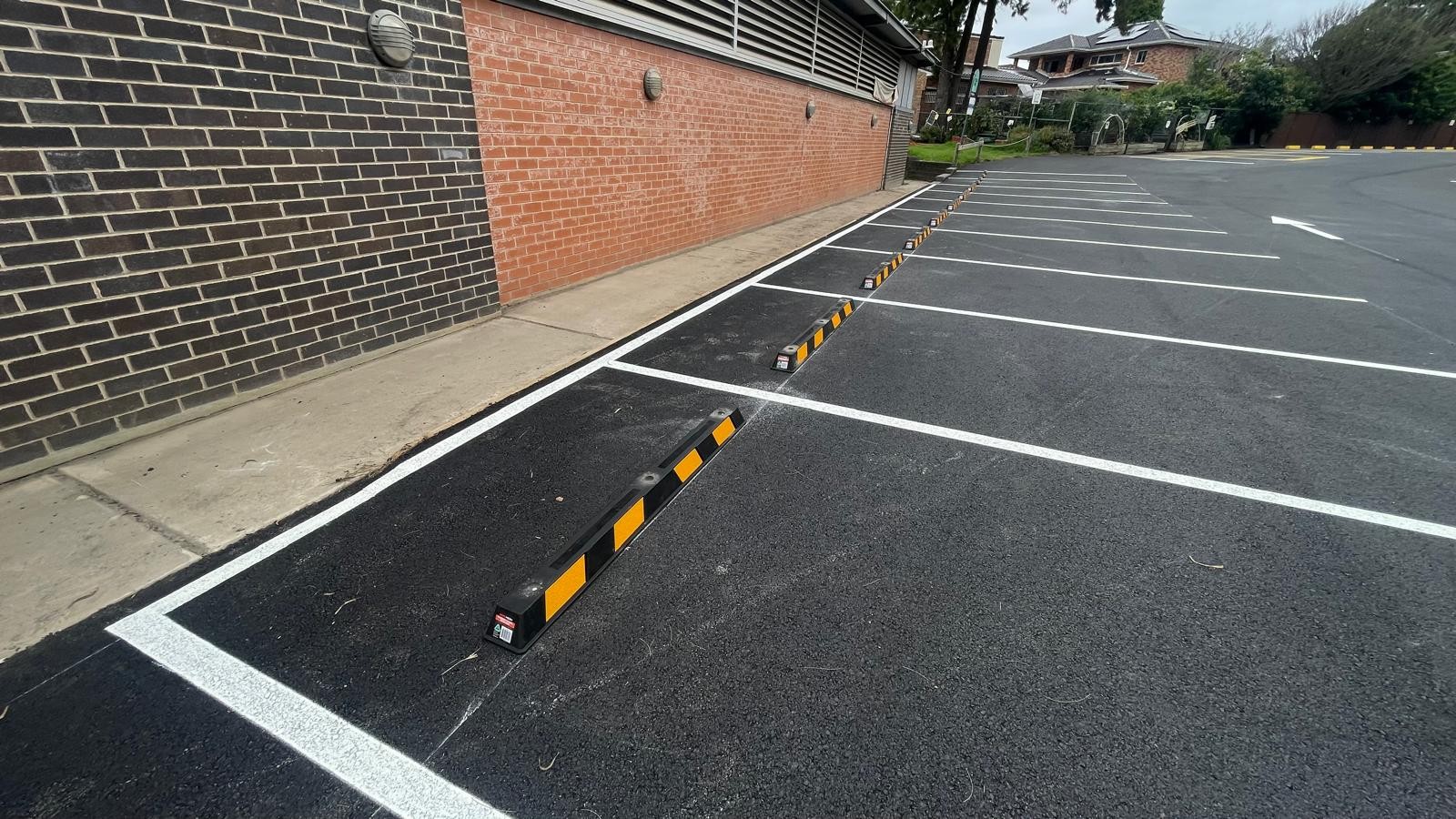 Installed wheel stops and marked parking bays